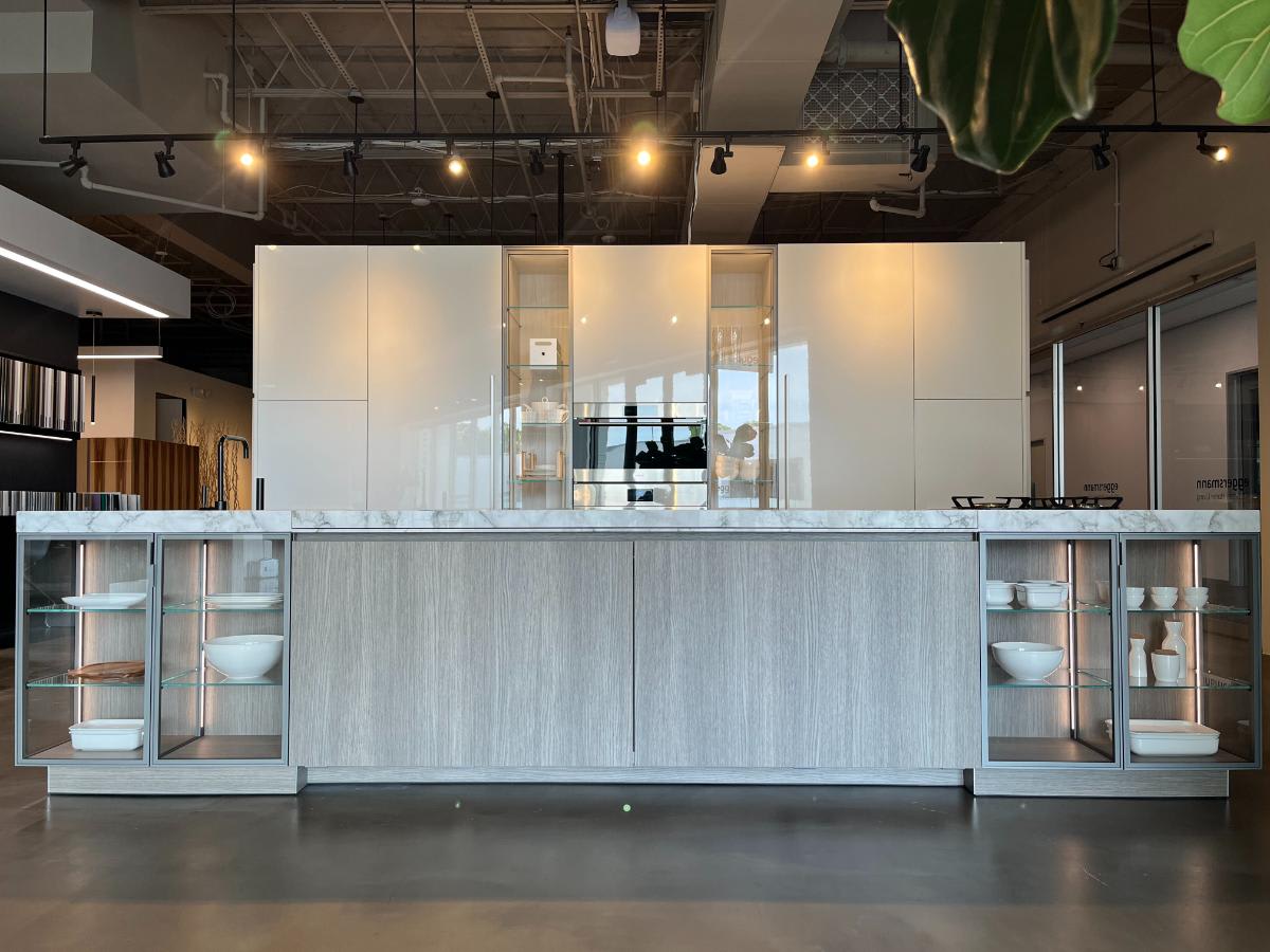 oversized galley kitchen island with glass-front display cases on each end