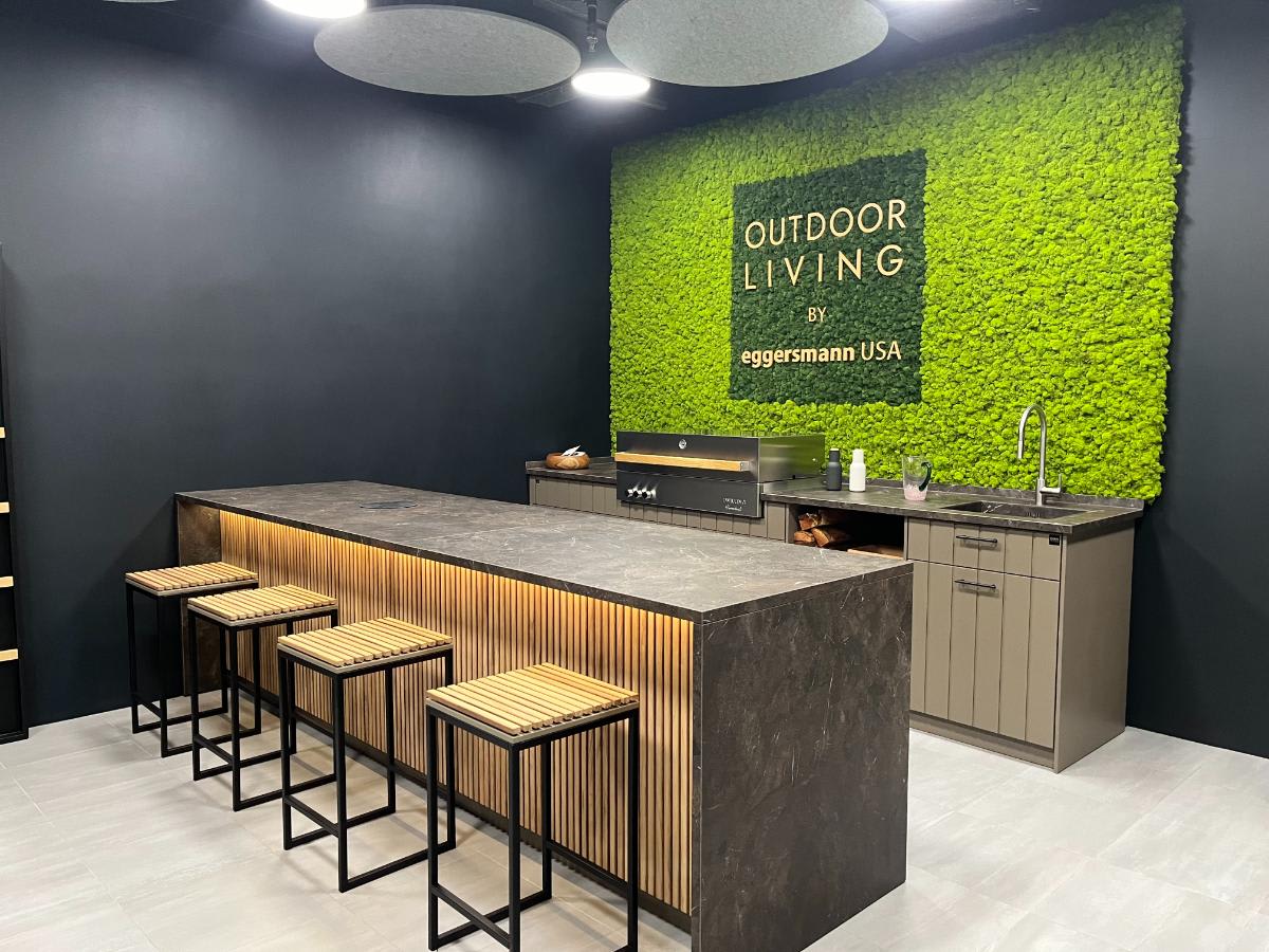 CUBIC outdoor kitchen island with barstools in the Houston Showroom outdoor living Display