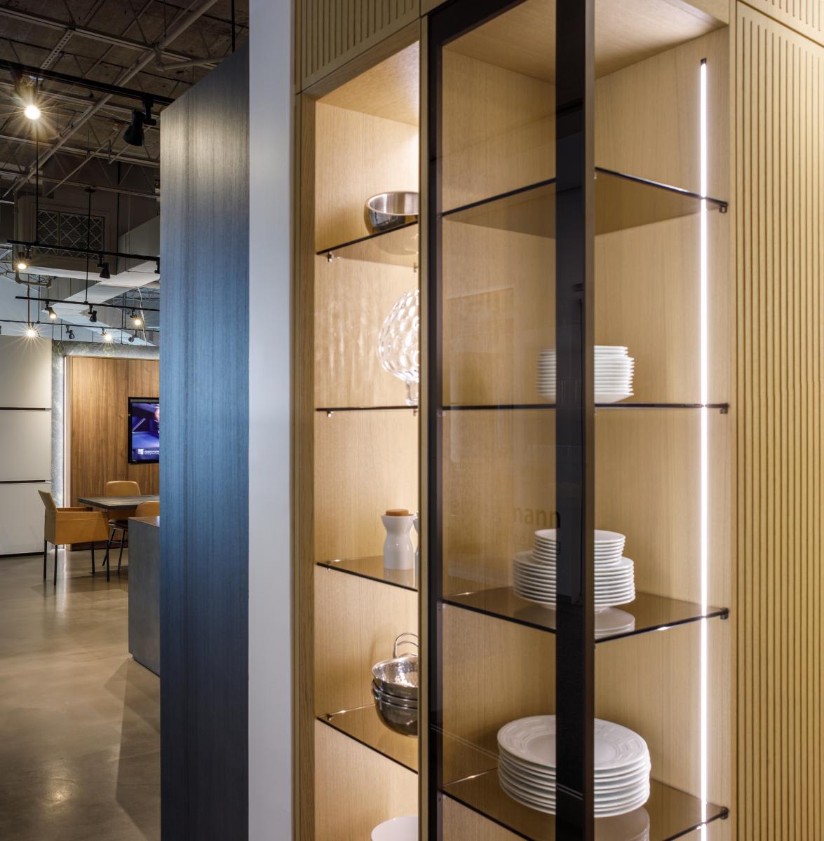 glow cabinetry unit open to the glass display side of the glow cabinetry unit osaka luxury wood veneer kitchen display in the eggersmann houston showroom