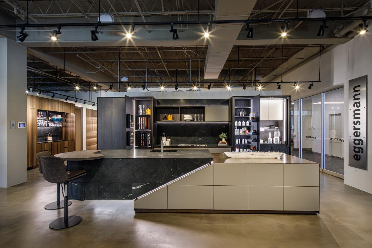 skywalk kitchen display with tall cabinets open in the eggersmann houston showroom