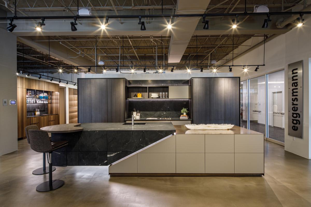 skywalk kitchen display with motionv sliding cabinet door on right side in the eggersmann houston showroom