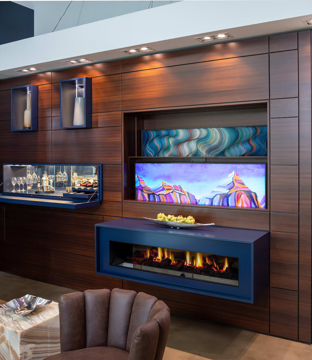 tv lift mechanism creates a hideaway tv that reveals artwork beneath it