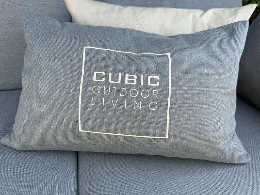 cubic outdoor living logo on an all-weather pillow