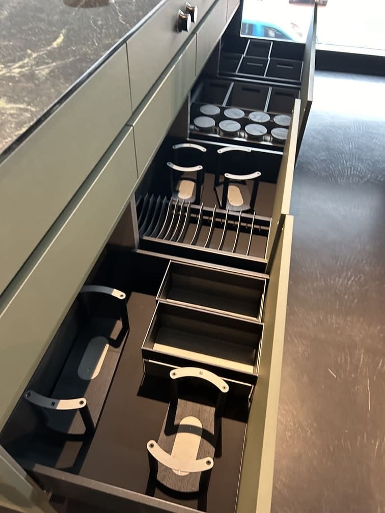 kitchen island featuring portland linoleum finished fronts in olive with a wide variety of boxtec organizers in open drawers