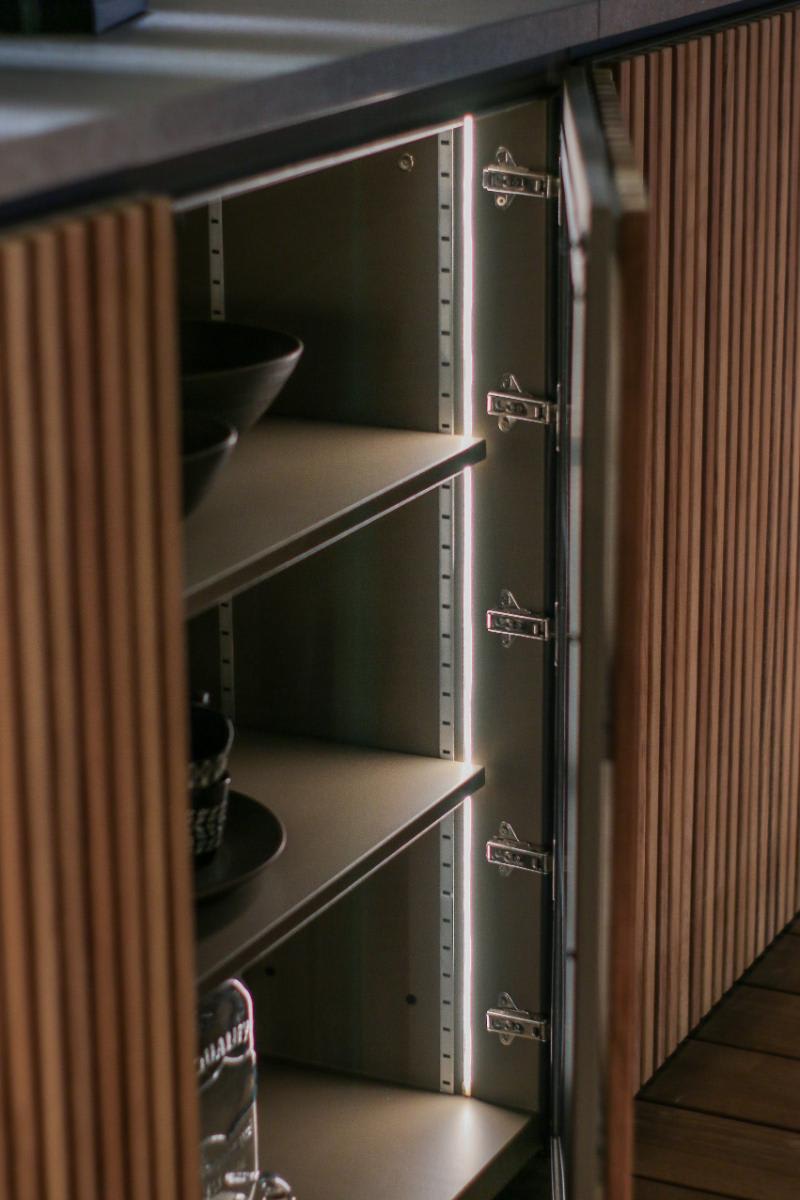 closeup of door hinges and shelves in cabinetry of a c1 pure outdoor kitchen by eggersmann outdoor living
