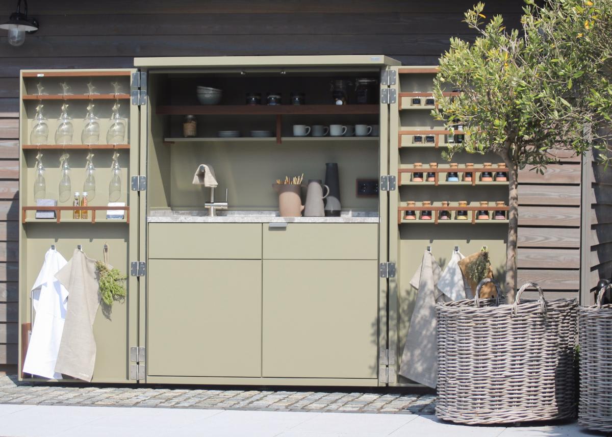 cubic outdoor living kitchen in a cupboard open doors