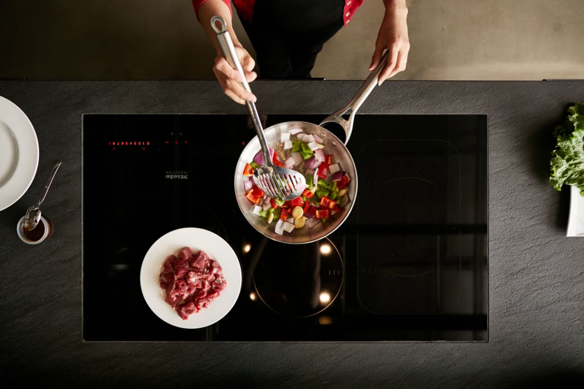 healthy meal prepared in a skillet on an induction cooktop
