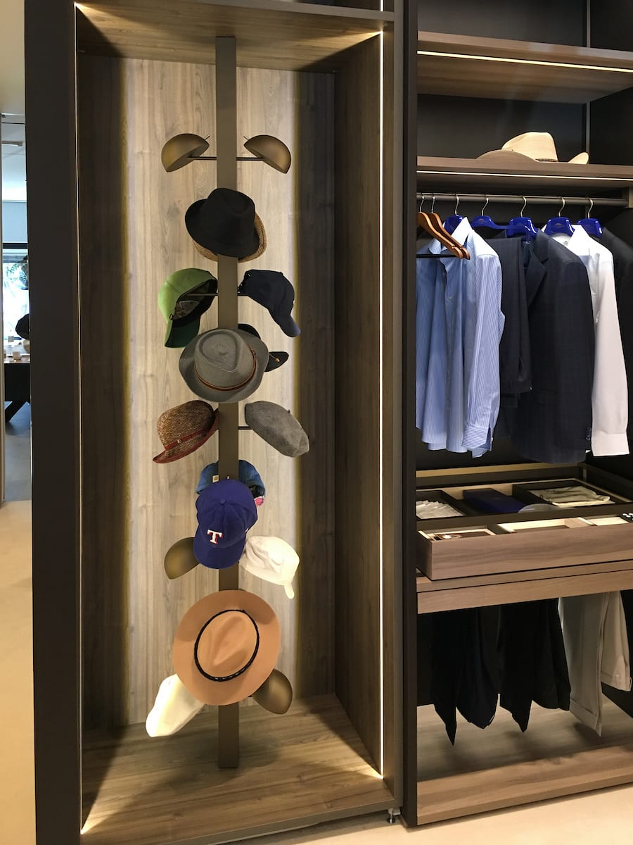 eggersmann-designed custom revolving hat storage tower in a luxury walk-in wardrobe