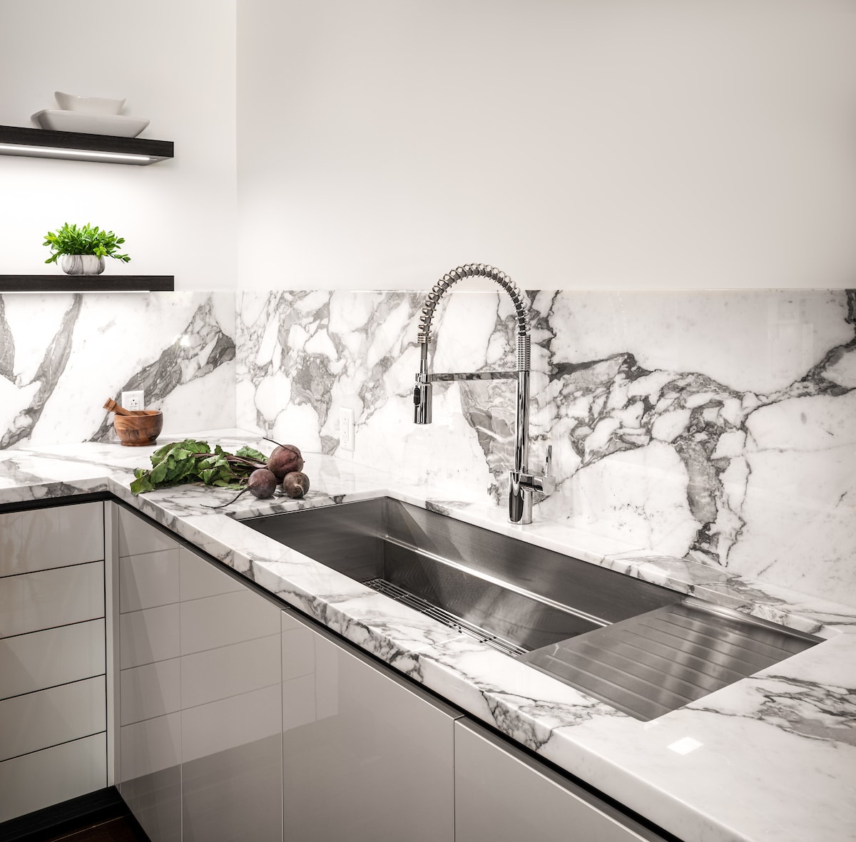 the galley sink in a white kitchen
