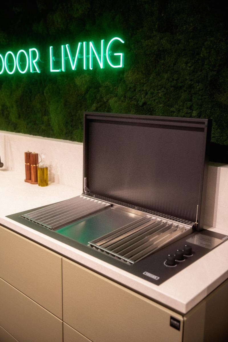 closeup of plancha grill with lid open in the cubic outdoor kitchen display in the eggersmann nyc showroom