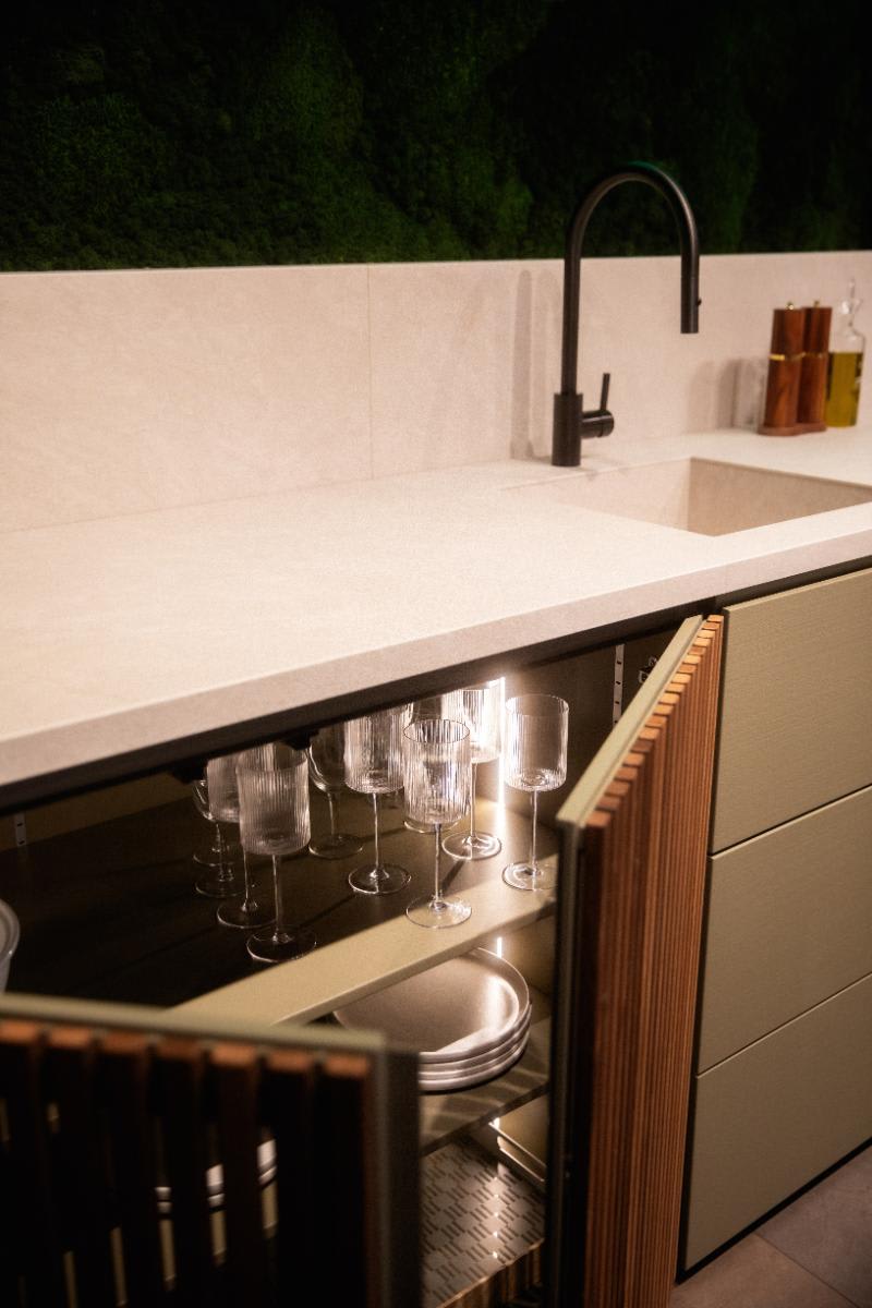 open cabinet with shelving an built-in led lighting of the cubic c4 outdoor kitchen in the eggersmann nyc outdoor kitchen display