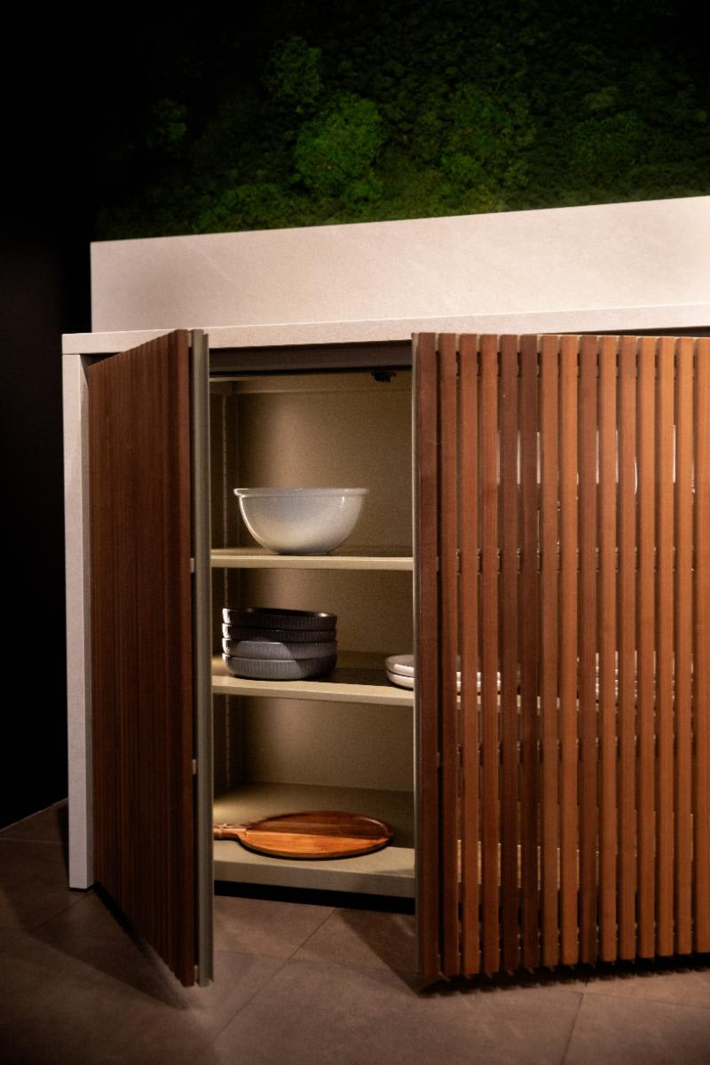 open cabinet with built-in led lighting of the cubic c4 outdoor kitchen in the eggersmann nyc outdoor kitchen display