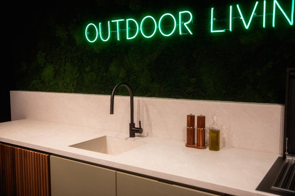 closeup of countertop and sink with gooseneck faucet of the cubic outdoor kitchen display in the eggersmann nyc showroom