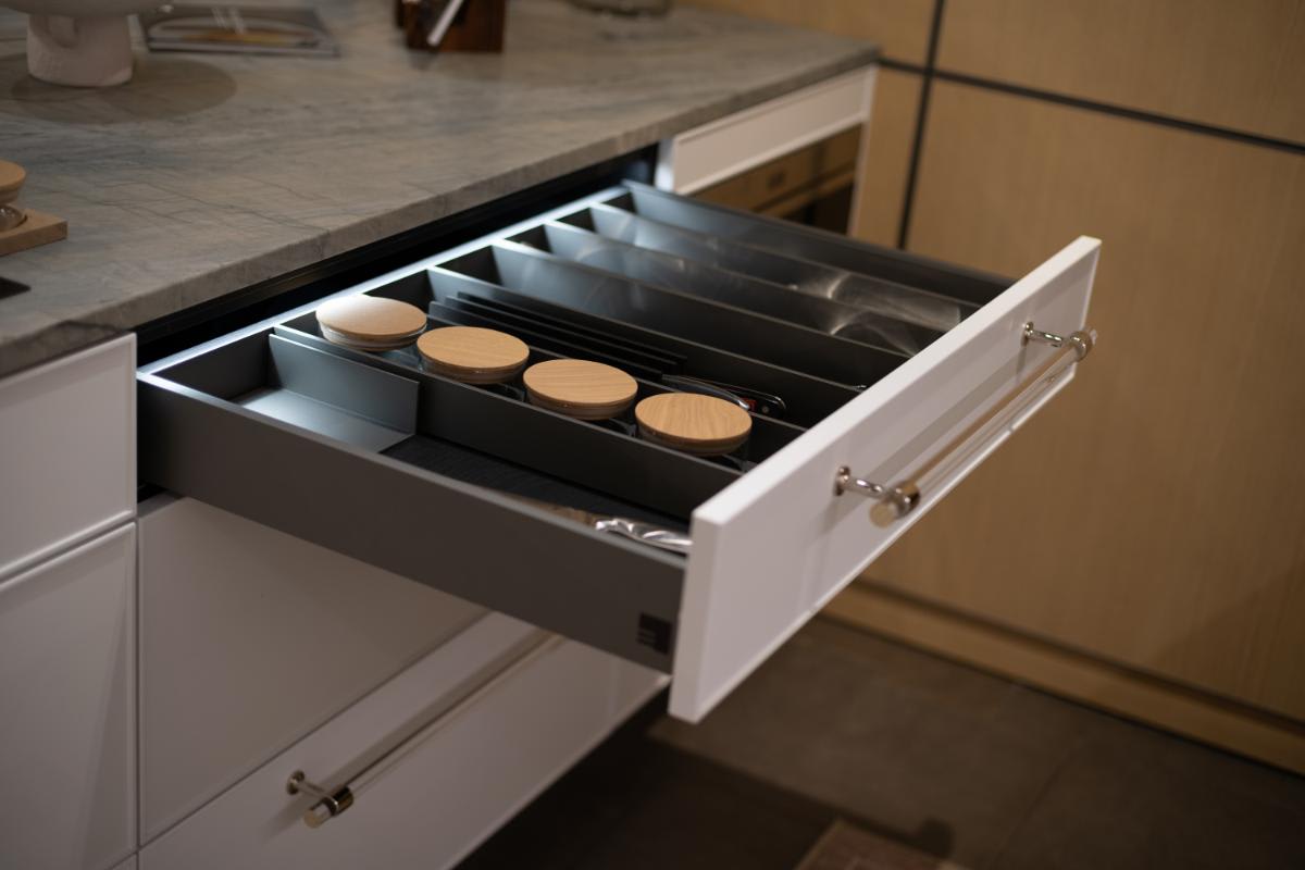 jars and utensil organizers from boxtec in a drawer of a eggersmann nyc showroom display kitchen