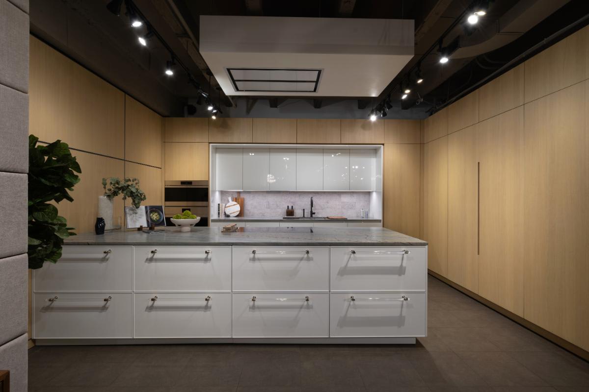 pocket door unit wall to hide a bar with storage in a eggersmann nyc showroom display kitchen