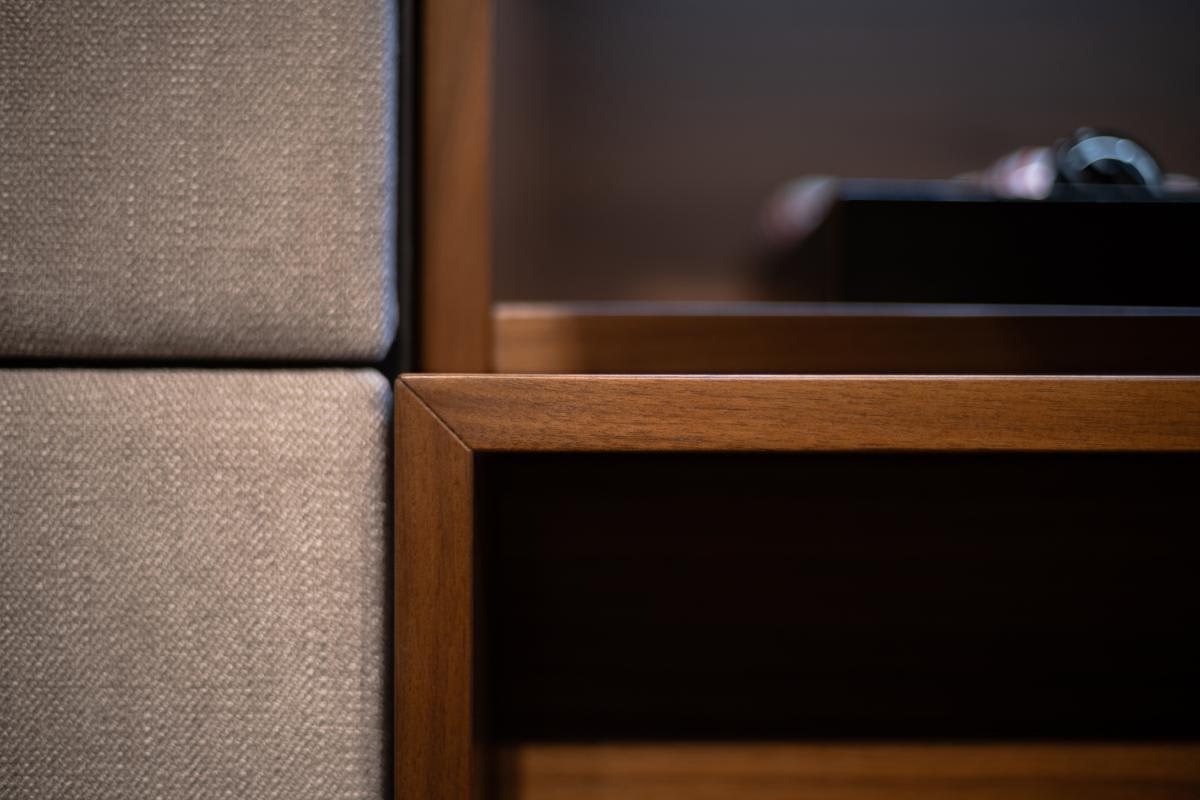 closeup of mitered detail on a side view of a eggersmann nyc showroom media wall display with the storage and table top console