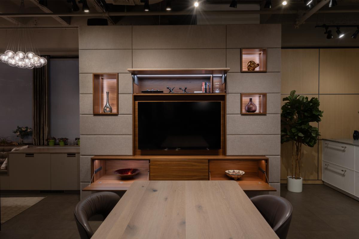 eggersmann nyc showroom media wall display with the storage and table top console open
