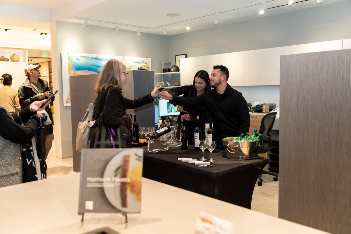 attendee being served ibest wine at design west hollywood 2025 in the eggersmann la showroom