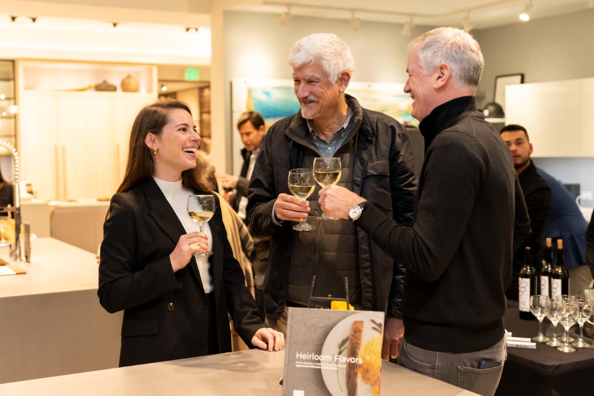 attendees enjoying wine and conversation at design west hollywood 2025 in the eggersmann la showroom