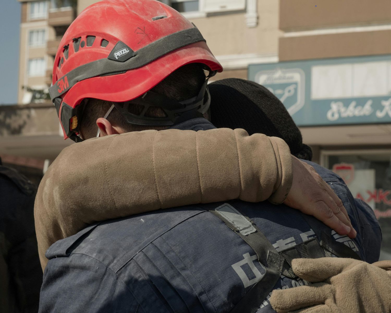 first responder and los angeles resident embrace during wildfires of 2025