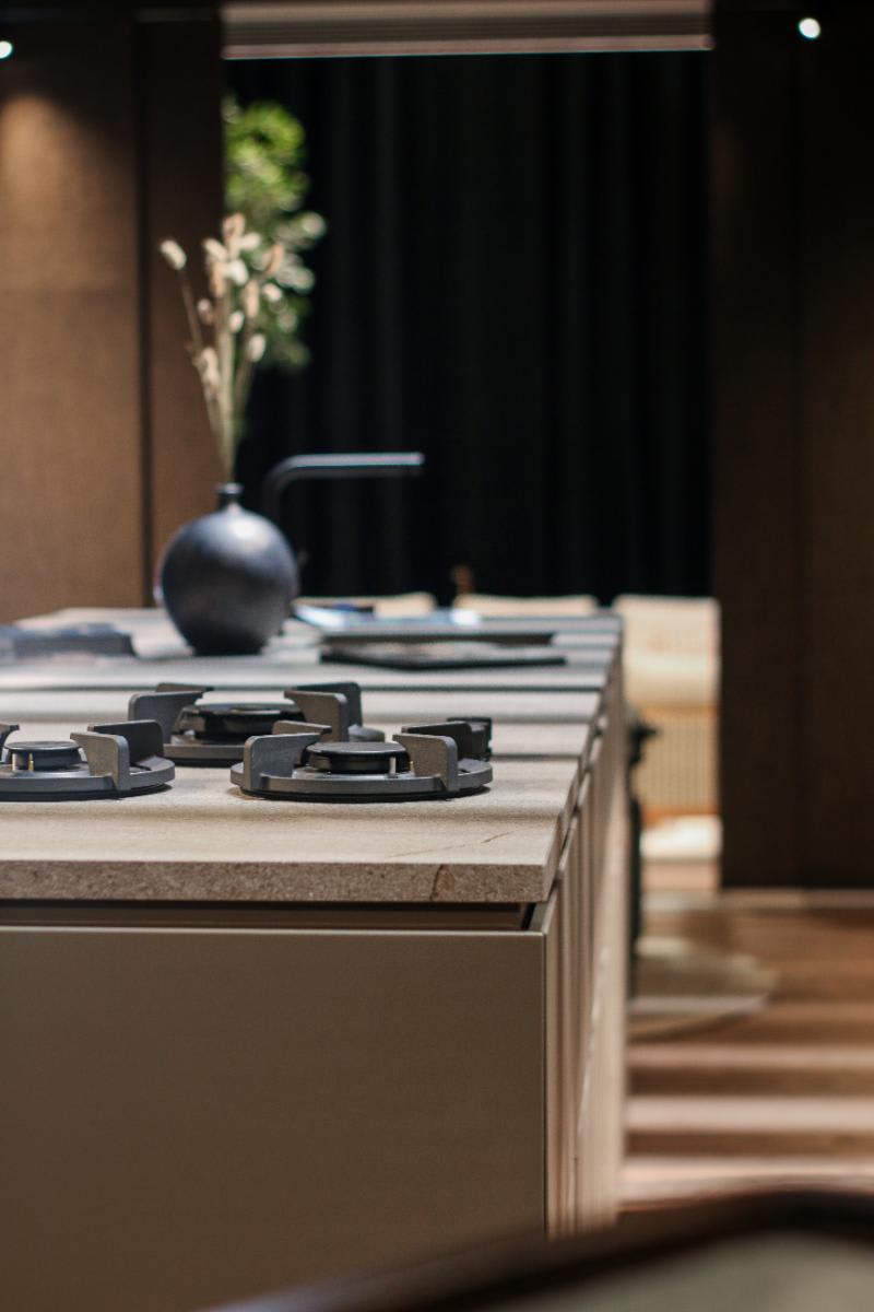 countertop-mounted burners in an outdoor kitchen designed by eggersmann and custom-crafted by cubic from its c1-pure collection