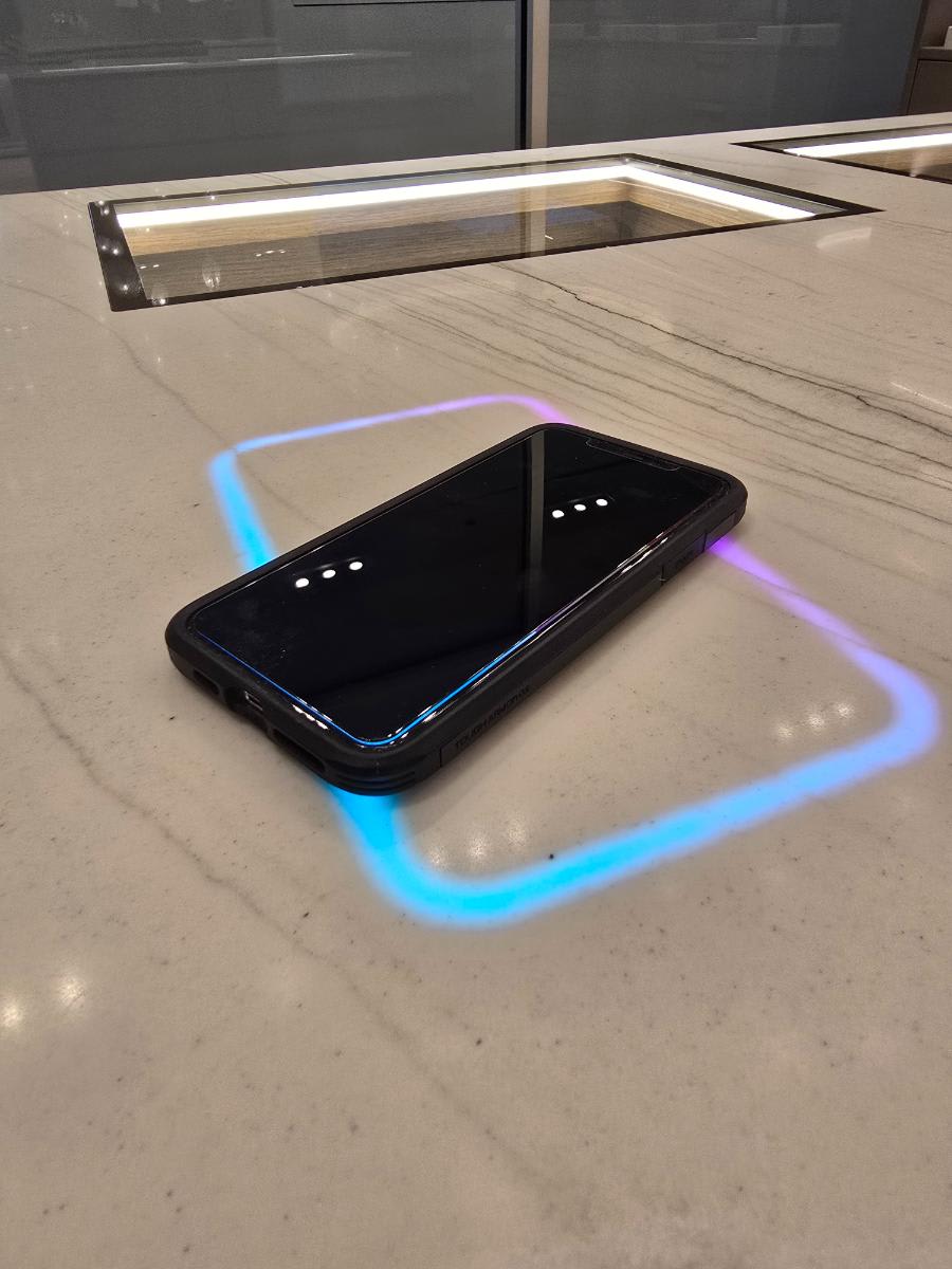 closeup of eggersmann houston showroom's luxury wardrobe's freepower charging halo invisible device charger for multiple devices