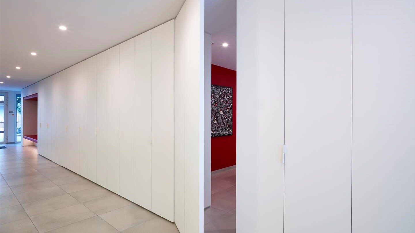 white laminate pivot door ajar