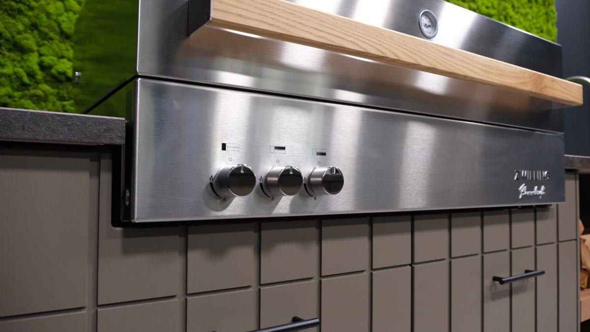 closeup of controls on front of a closed flammkraft grill in the cubic outdoor kitchen display at eggersmann houston2