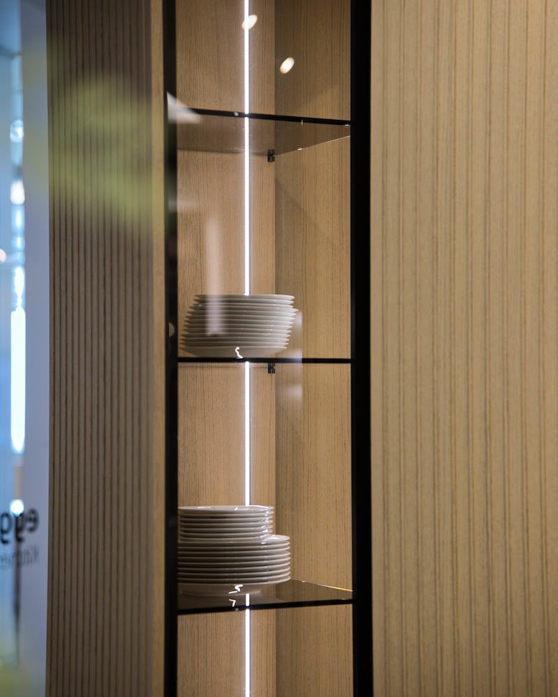 glass-front display side of a glow revolving cabinet in a kitchen display in the eggersmann houston showroom