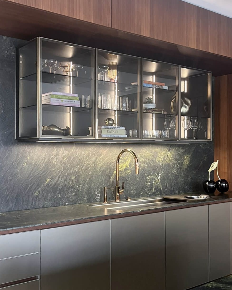 glance glass-front upper cabinets in a modern eggersmann kitchen