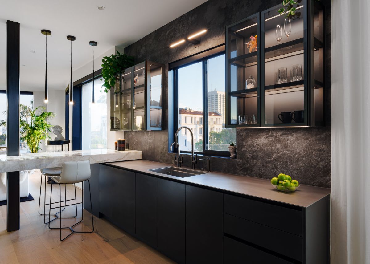 glass front cabinetry with integrated led lighting designed by eggersmann los angeles