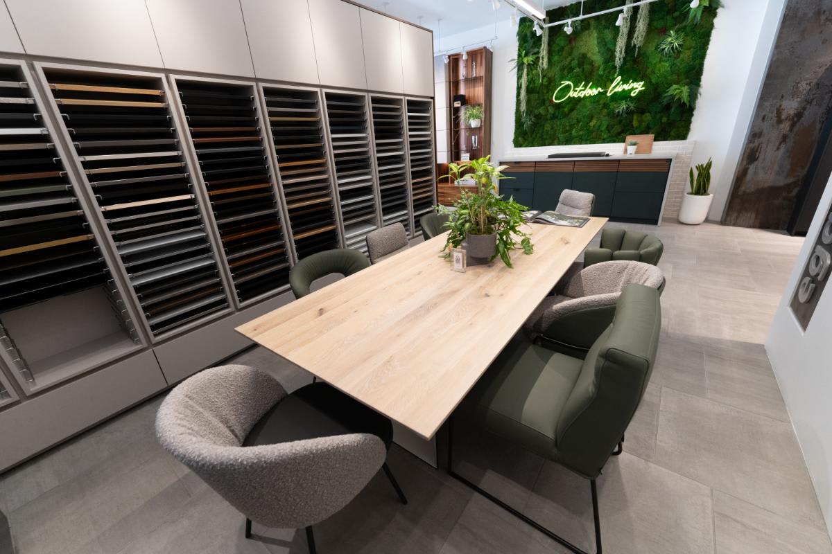 bespoke table and chairs in a conference room display area inside eggersmann la showroom