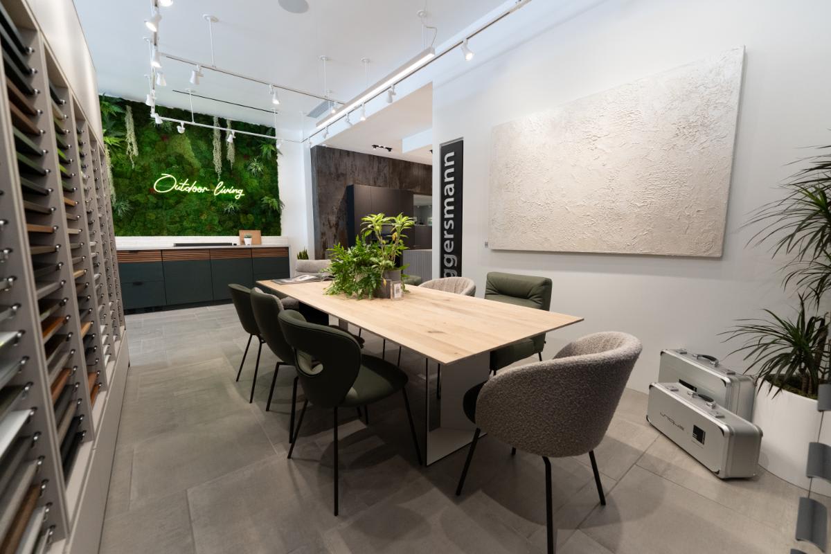 conference room with sample display area with cubic outdoor living display in background inside eggersmann la showroom