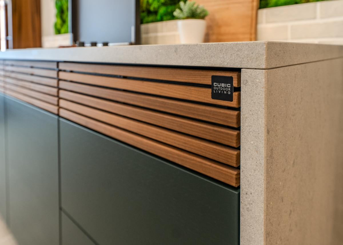closeup of slatted drawer fronts of the c4 kitchen island in the cubic outdoor kitchen display inside eggersmann la showroom