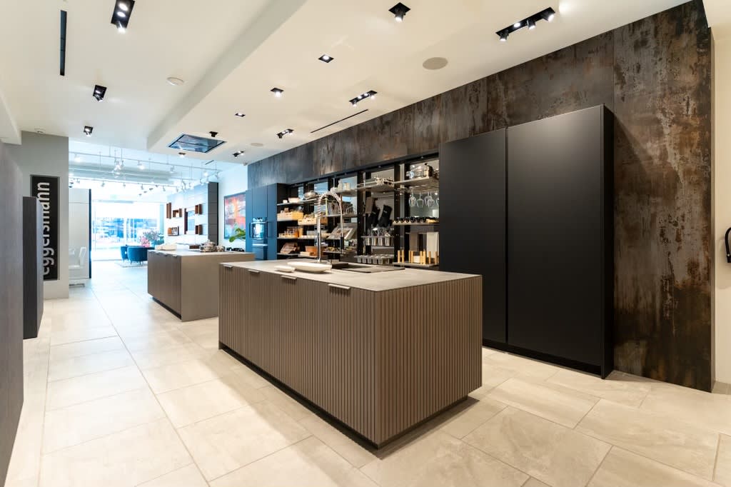 all turnstile pantries open ithe work's pantry display with dual kitchen islands in the eggersmann la showroom