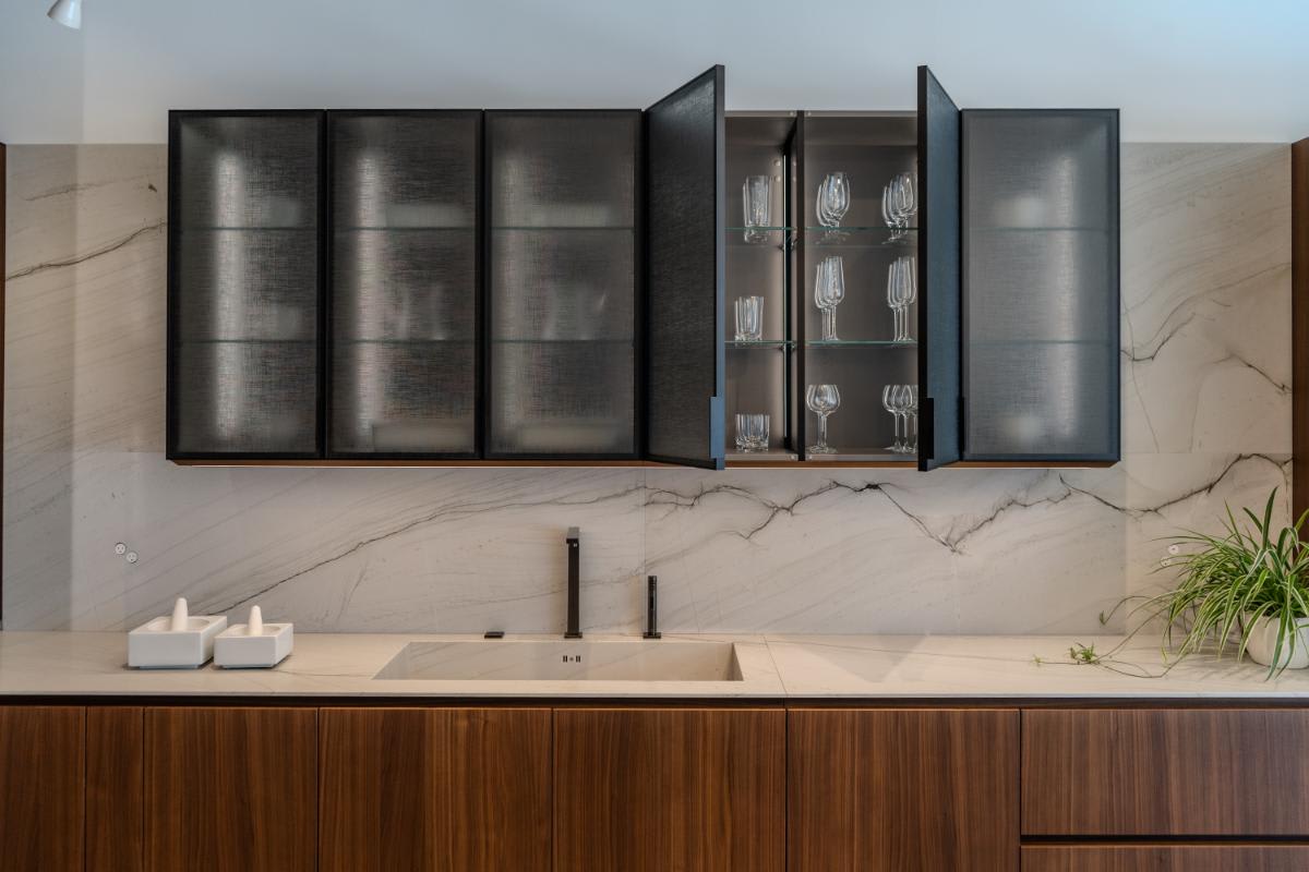 open cabinets in the smoked glass glance upper cabinets in the skywalk kitchen in the eggersmann la showroom