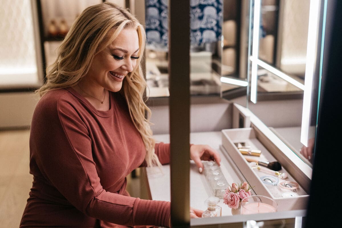 emma j carter enjoys using the custom makeup vanity in the walk-in wardrobe display in the eggersmann la showroom