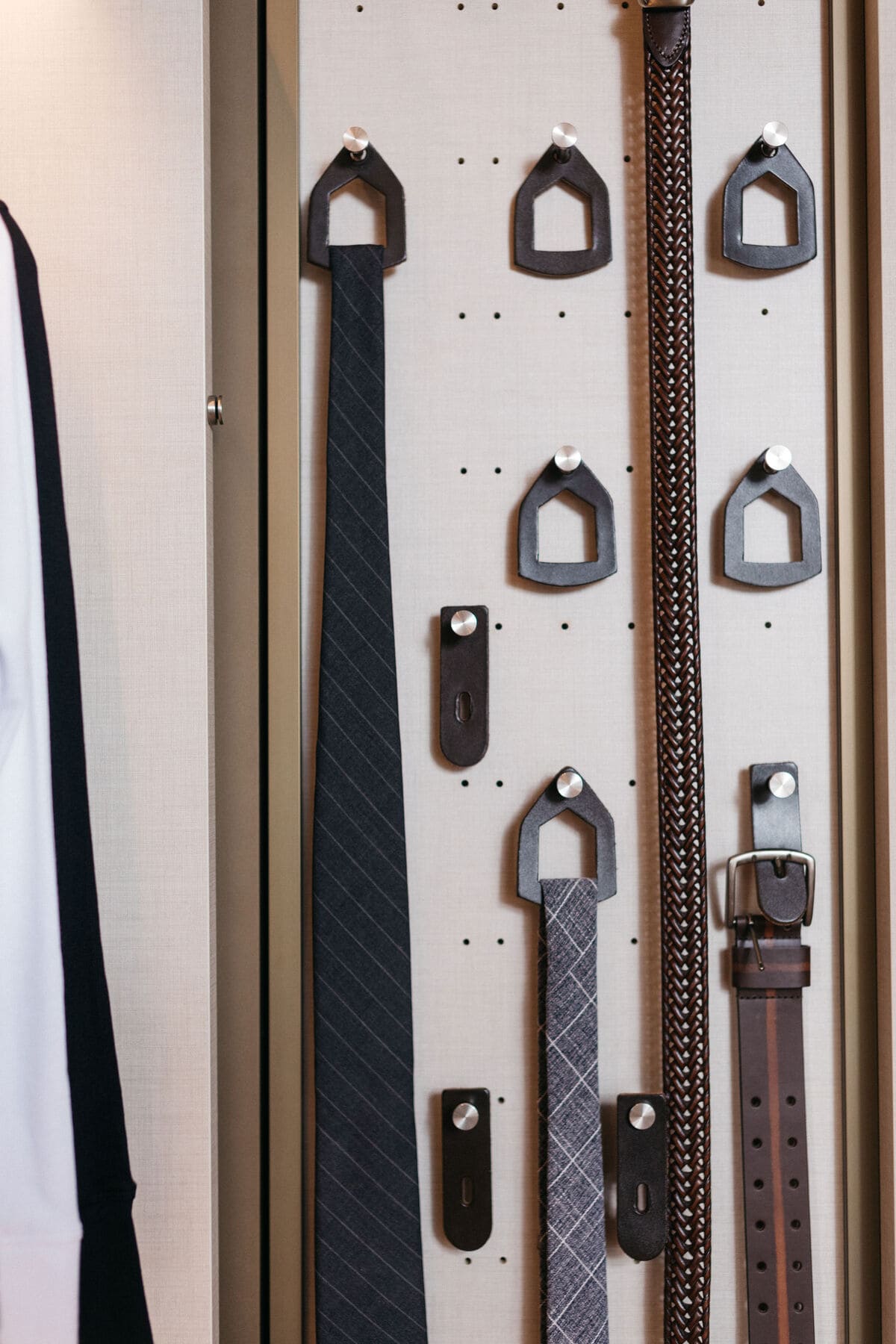 pull-out storage for ties and belts in the walk-in wardrobe display in the eggersmann la showroom