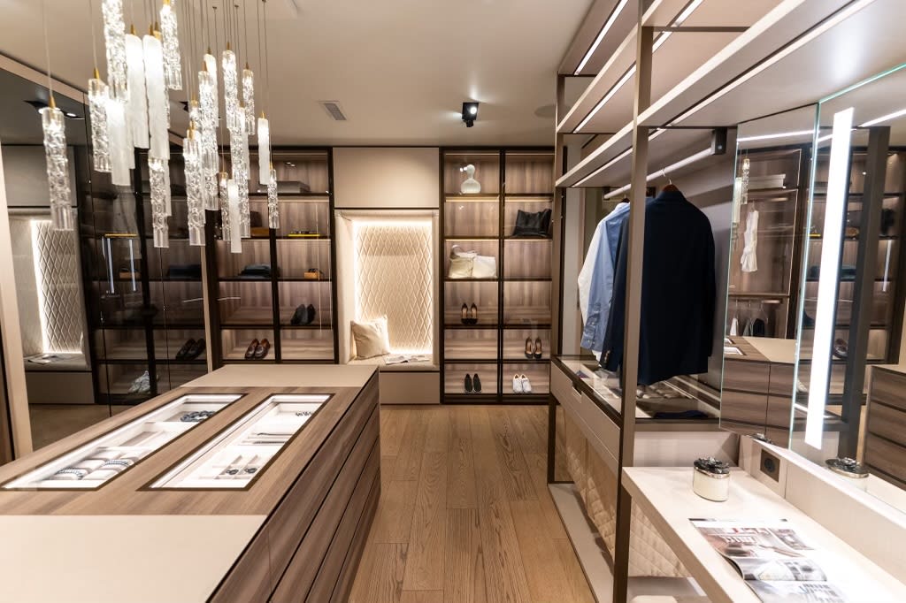luxury walk-in wardrobe display with storage island in the eggersmann la showroom