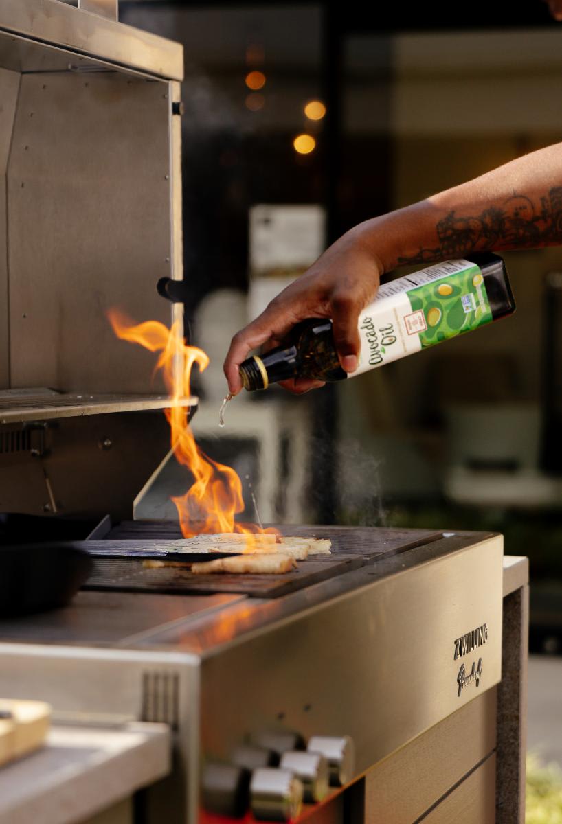 grillmaster oils griddle of the outdoor kitchen display at eggersmann laguna while preparing food to be served during the CUBIC event in august 2025