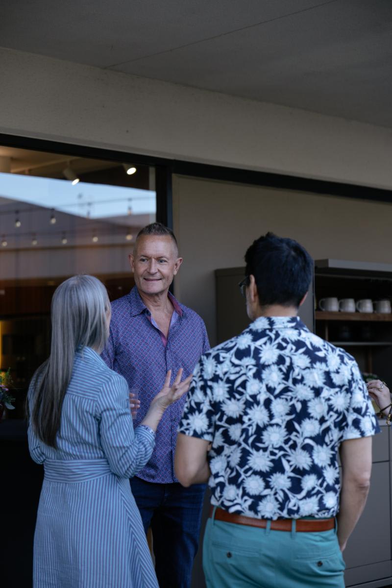 guests talk outdoor design with showroom manager kelly lafosse during the CUBIC event in august 2025 at egersmann laguna