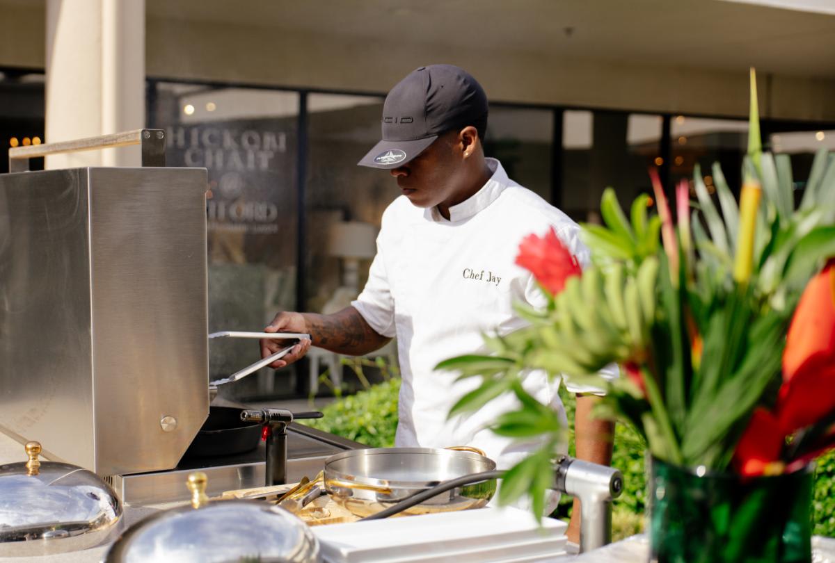 grillmaster preparing food in the outdoor kitchen display at eggersmann laguna to be served during the CUBIC event in august 2025