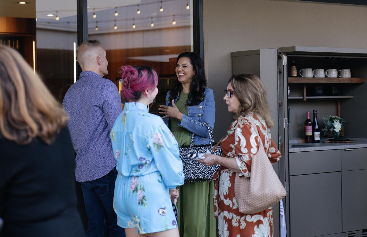 guests enjoying conversation next to the kitchen in a cupboard at an outdoor living event in august 2025 at eggersmann laguna