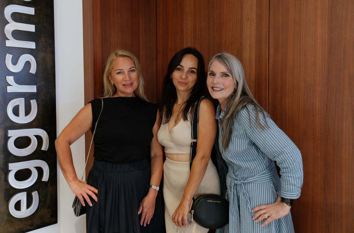 guests posed with showroom manager kelly lafosse at eggersmann laguna during an outdoor living event in august 2025