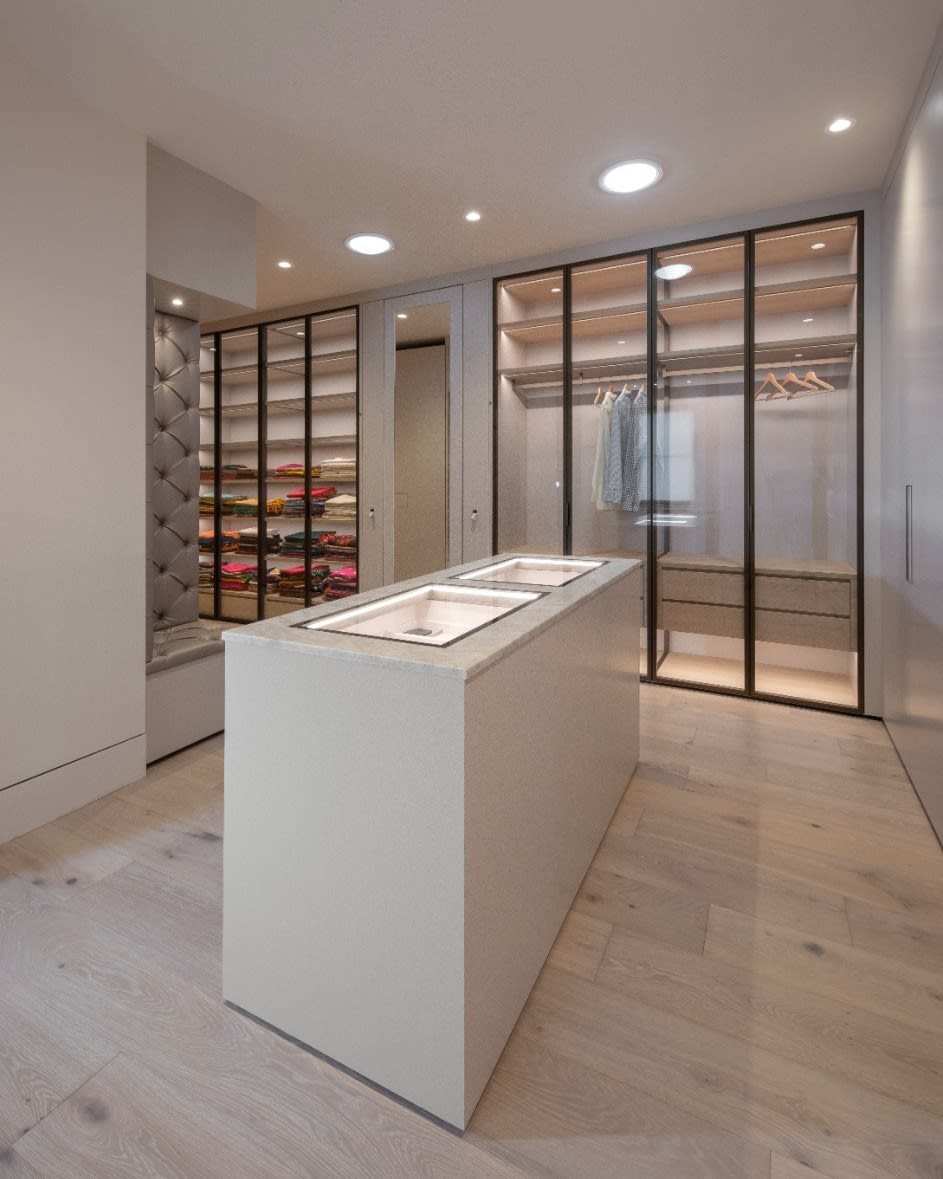 jewelry display case island featured in a luxury walk-in wardrobe designed by eggersmann scottsdale for a fulton ranch home