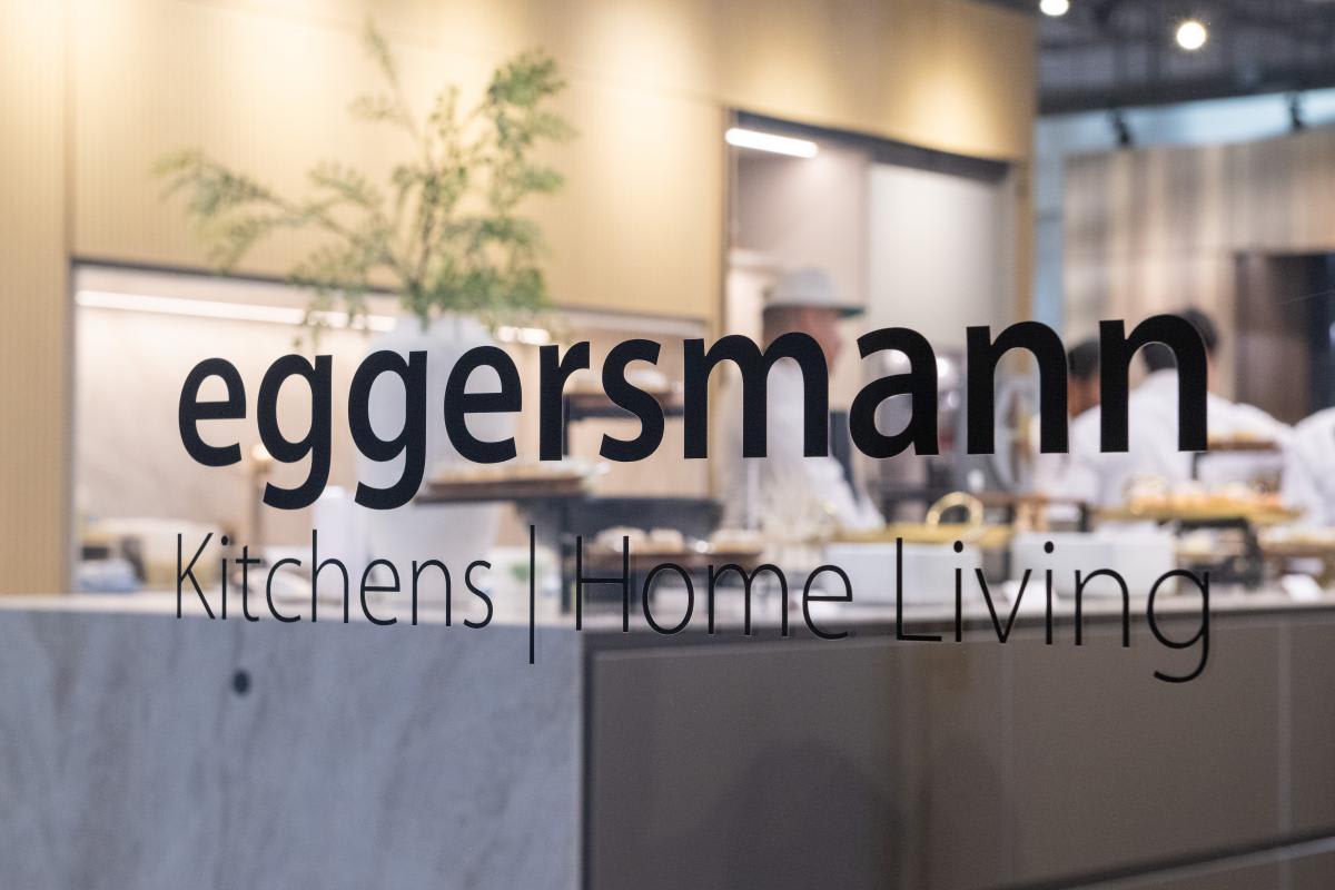 eggersmann home living logo on glass in foyer of decorative center houston looking into a kitchen display with buffet ready for aia home tour 2025 appreciation party