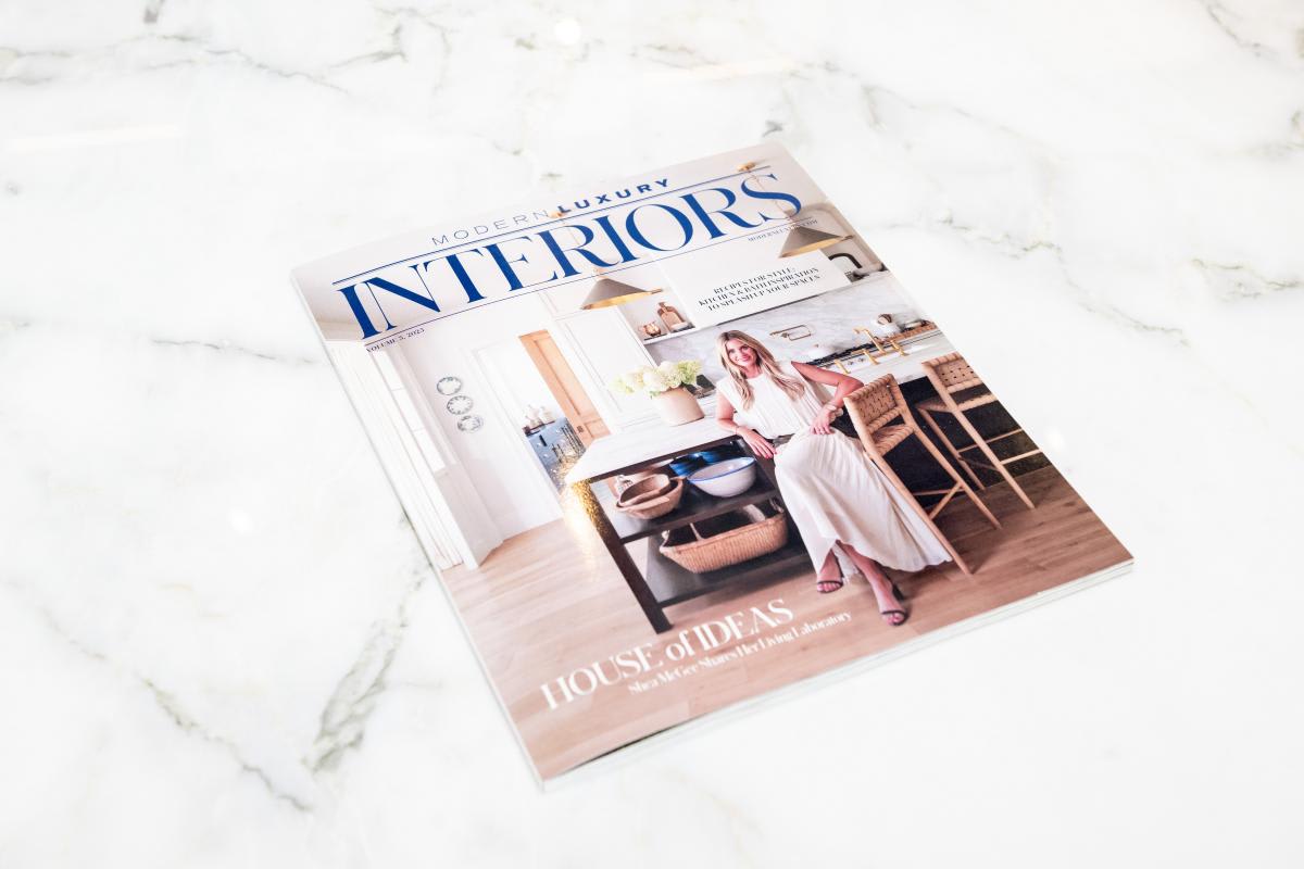 modern luxury interiors magazine on a kitchen island in the eggersmann houston showroom during the aia home tour 2025 appreciation party that the magazine sponsored