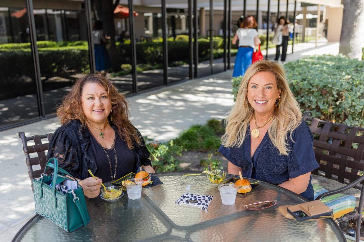 seated guests enjoying appetizers outside the eggersmann laguna showroom during the laguna market in september 2025