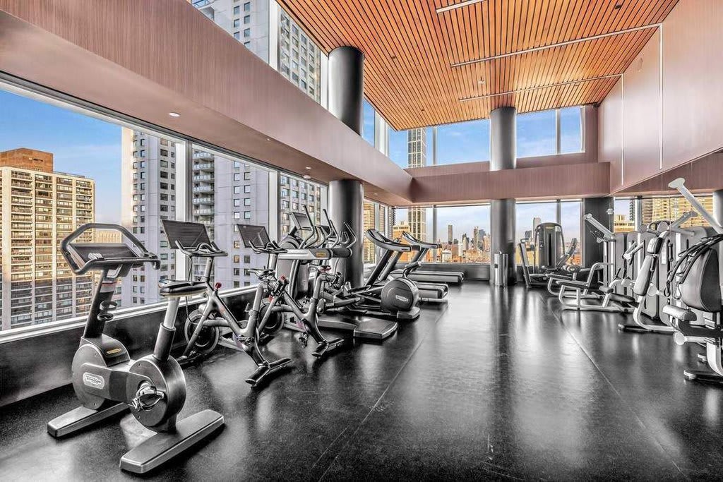fitness room with view of manhattan in 252 east 57th in nyc
