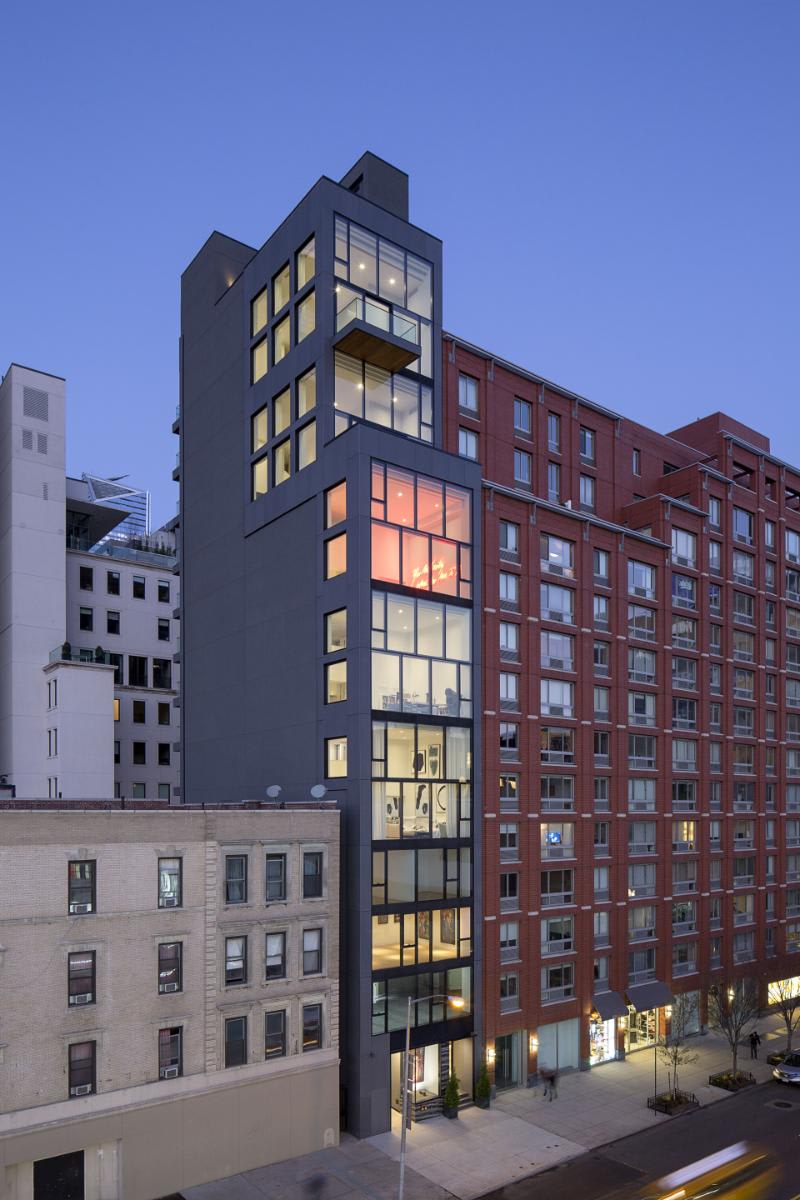 left side and front of chelsea waterside nyc building taken at night from W 23rd Street, new york city
